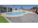 Backyard oasis featuring a sparkling pool with built in sun shelf, ideal for summer relaxation at 727 N Beverly --, Mesa, AZ 85201