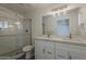 A modern bathroom with double sink vanity and shower with glass doors at 727 N Beverly --, Mesa, AZ 85201