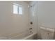 Bathroom with a white tiled shower/tub combo and modern fixtures at 727 N Beverly --, Mesa, AZ 85201