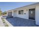 Stylish home exterior featuring updated gray brickwork, a black front door and landscaping at 727 N Beverly --, Mesa, AZ 85201