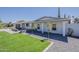 Well-kept single-story home with a lush green lawn and fresh desert landscaping at 727 N Beverly --, Mesa, AZ 85201