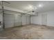 Spacious garage with a roll-up door and concrete floor, ready for parking and storage at 727 N Beverly --, Mesa, AZ 85201