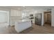 Modern kitchen featuring white cabinetry, an island with marble countertops, and stainless steel appliances at 727 N Beverly --, Mesa, AZ 85201