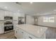 Beautiful kitchen with large center island with stone countertop, stainless steel appliances, and an open design at 727 N Beverly --, Mesa, AZ 85201