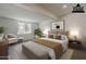 Serene main bedroom with a cozy bed, complemented by soft lighting and views of the outdoors at 727 N Beverly --, Mesa, AZ 85201
