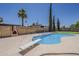 Beautiful pool with diving board and a built-in fireplace, great for outdoor enjoyment at 727 N Beverly --, Mesa, AZ 85201