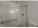 Modern bathroom featuring tiled shower with sliding glass doors and updated fixtures at 727 N Beverly --, Mesa, AZ 85201
