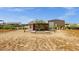 Backyard area with a custom-built chicken coop featuring a secure run for poultry and ample space for expansion at 856 W Quail Cir, San Tan Valley, AZ 85143