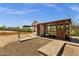 Exterior of backyard gate entrance providing added security and style to the property's boundary at 856 W Quail Cir, San Tan Valley, AZ 85143