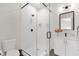 Modern bathroom with glass-enclosed shower, sleek fixtures, and white vanity at 856 W Quail Cir, San Tan Valley, AZ 85143