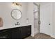 Stylish bathroom with a vanity featuring black hardware and a glass-enclosed shower at 856 W Quail Cir, San Tan Valley, AZ 85143