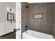 Bathroom with modern glass enclosed shower and stylish gray tiling at 856 W Quail Cir, San Tan Valley, AZ 85143