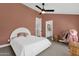 Bedroom with a ceiling fan and views into both the hallway and the bathroom at 856 W Quail Cir, San Tan Valley, AZ 85143
