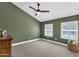 Spacious bedroom featuring vaulted ceilings, dual windows with shutters, and a ceiling fan at 856 W Quail Cir, San Tan Valley, AZ 85143
