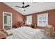 Bedroom with neutral decor, ceiling fan, white trim, and ample natural light at 856 W Quail Cir, San Tan Valley, AZ 85143