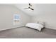 Bright bedroom with vaulted ceiling, neutral walls, and a simple, comfortable bed at 856 W Quail Cir, San Tan Valley, AZ 85143
