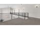 Hallway overlooking a spacious main floor with modern black railing at 856 W Quail Cir, San Tan Valley, AZ 85143