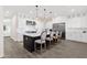 Modern kitchen with center island, stainless appliances, and elegant pendant lighting at 856 W Quail Cir, San Tan Valley, AZ 85143