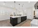 Eat-in kitchen island with stainless steel appliances and dark hardwood cabinets at 856 W Quail Cir, San Tan Valley, AZ 85143