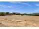 Large plot of land surrounded by lush trees with ample space for building, recreation, and peaceful enjoyment at 856 W Quail Cir, San Tan Valley, AZ 85143