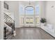 Spacious living room with large windows, a chandelier, and modern, neutral decor at 856 W Quail Cir, San Tan Valley, AZ 85143