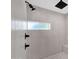 Walk-in shower with rain shower head, square shower head, and a window for natural light at 856 W Quail Cir, San Tan Valley, AZ 85143