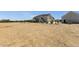 View of the property displaying home, outbuilding, and open space, perfect for equestrian activities or other hobbies at 856 W Quail Cir, San Tan Valley, AZ 85143