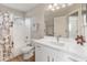 Clean bathroom with neutral walls features white vanity, decorative fixtures and shower/tub combination at 1073 N 159Th Dr, Goodyear, AZ 85338