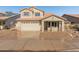 Charming two-story home featuring a neutral-tone facade, a two-car garage, and a well-maintained landscape at 1073 N 159Th Dr, Goodyear, AZ 85338