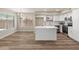 Open-concept kitchen and dining area, boasting stainless steel appliances and a central island at 1073 N 159Th Dr, Goodyear, AZ 85338