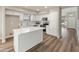 Modern kitchen with an island, stainless steel appliances, and bright white cabinets at 1073 N 159Th Dr, Goodyear, AZ 85338