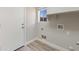 Bright laundry room featuring a utility sink and convenient washer/dryer hookups at 1073 N 159Th Dr, Goodyear, AZ 85338