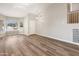 Inviting living room featuring wood-look floors and abundant natural light at 1073 N 159Th Dr, Goodyear, AZ 85338