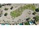Drone image of neighborhood golf course and nearby homes with swimming pools in backyard at 1075 E Crimm Rd, San Tan Valley, AZ 85143