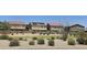 View of backyards with privacy walls and desert landscaping across the street at 1075 E Crimm Rd, San Tan Valley, AZ 85143