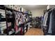 This walk-in closet features lots of space for clothes and shoes and built-in shelves and organizers at 1075 E Crimm Rd, San Tan Valley, AZ 85143