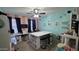 Creative craft room with a large central table, storage solutions, and a vibrant, inspiring design at 1075 E Crimm Rd, San Tan Valley, AZ 85143