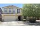 Charming two-story home with a two-car garage and welcoming front porch at 1075 E Crimm Rd, San Tan Valley, AZ 85143