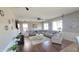 Spacious living room with plush seating, stylish decor, and ample natural light at 1075 E Crimm Rd, San Tan Valley, AZ 85143