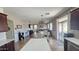 Bright and airy living space seamlessly connecting to the kitchen and outdoor patio area at 1075 E Crimm Rd, San Tan Valley, AZ 85143