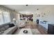Open-concept living room flowing into the kitchen, showcasing seamless design and connectivity at 1075 E Crimm Rd, San Tan Valley, AZ 85143