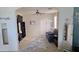 This living room features neutral walls, area rugs, neutral carpet, decor shelving, and sliding glass doors at 1075 E Crimm Rd, San Tan Valley, AZ 85143