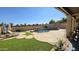Inviting backyard pool featuring a rock waterfall, lush landscaping, and lounge chairs for relaxation at 1075 E Crimm Rd, San Tan Valley, AZ 85143
