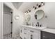Modern bathroom features a dual sink vanity, round mirrors and designer tile flooring at 10830 N 11Th St, Phoenix, AZ 85020