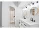 Modern bathroom featuring double sinks, stylish mirrors, and beautiful tile flooring at 10830 N 11Th St, Phoenix, AZ 85020