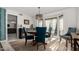 Bright dining room featuring stylish chandelier, blue chairs, and ample natural light at 10830 N 11Th St, Phoenix, AZ 85020