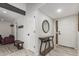 Inviting foyer with decorative mirror, console table, and stylish tile flooring at 10830 N 11Th St, Phoenix, AZ 85020