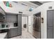 Bright kitchen with gray cabinets, stainless steel refrigerator and stainless steel appliances at 10830 N 11Th St, Phoenix, AZ 85020