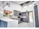 Modern kitchen with stainless steel appliances, gray cabinets, and ample counter space at 10830 N 11Th St, Phoenix, AZ 85020