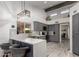 Updated kitchen featuring gray cabinets, stainless steel appliances and a stylish light fixture at 10830 N 11Th St, Phoenix, AZ 85020